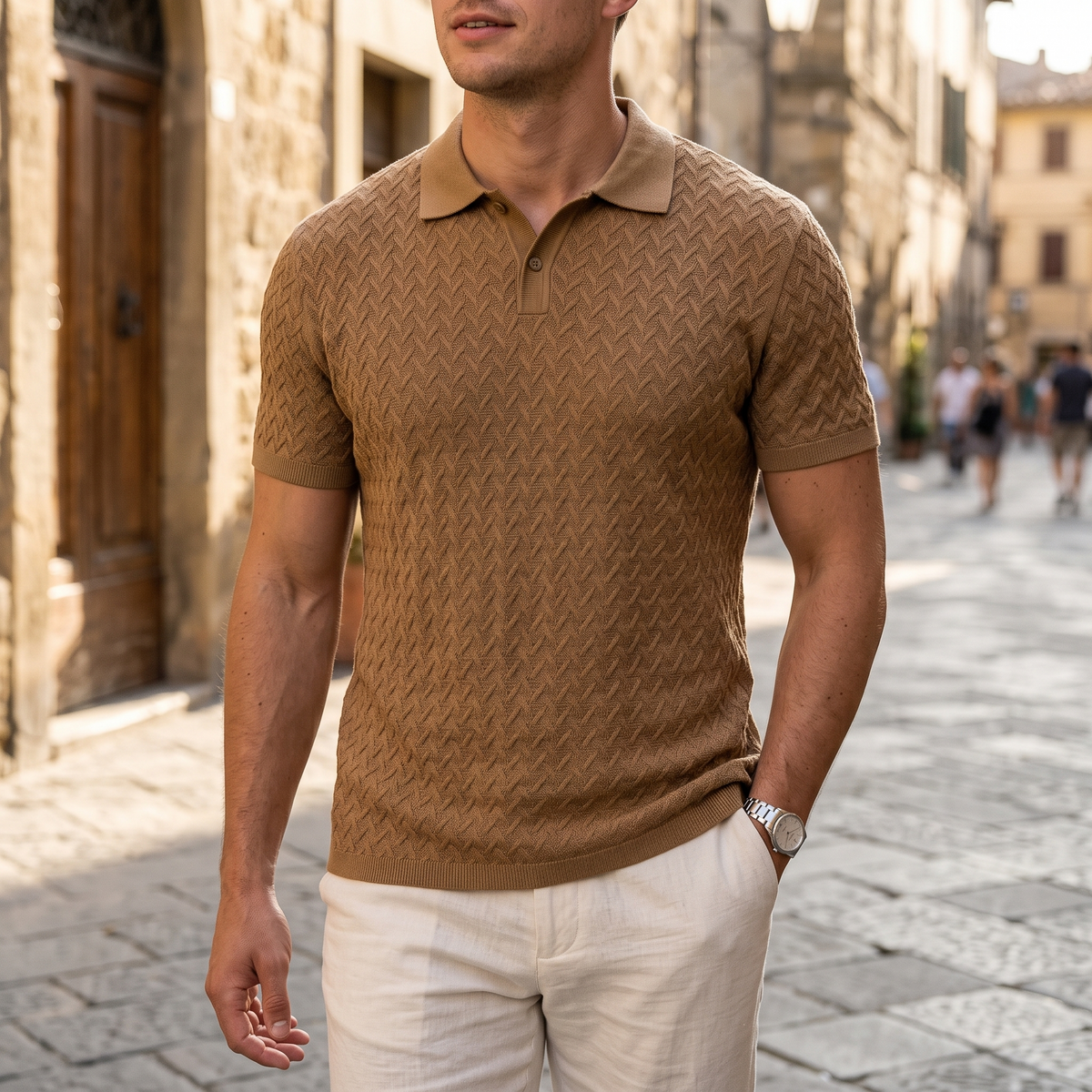 Callan dark khaki textured knit polo worn on an old town street