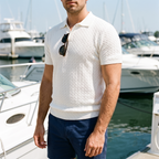 Callan white textured knit polo worn at a marina
