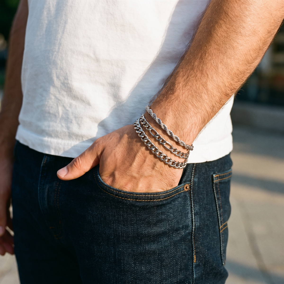 Dorian set of three silver chain bracelets worn with jeans and a white tee