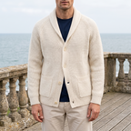 Hollis white button knit cardigan worn by the sea