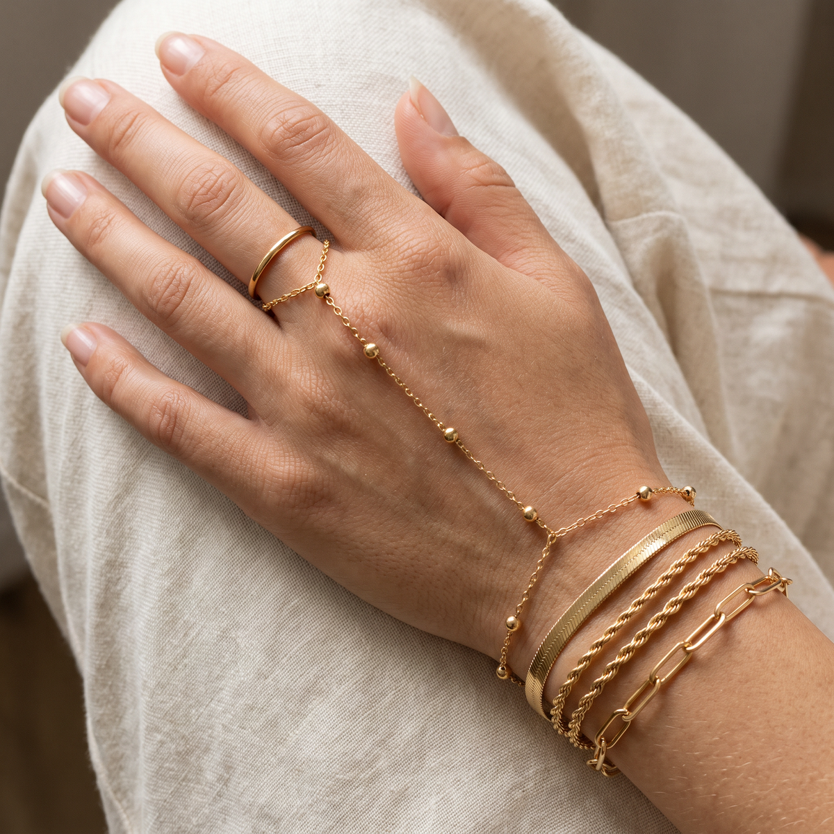 Close up of the Ondine beaded hand chain and finger ring