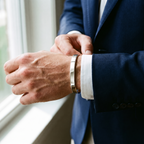 Vance open cuff bangle, bold 5 mm white gold tone, worn with a navy blazer