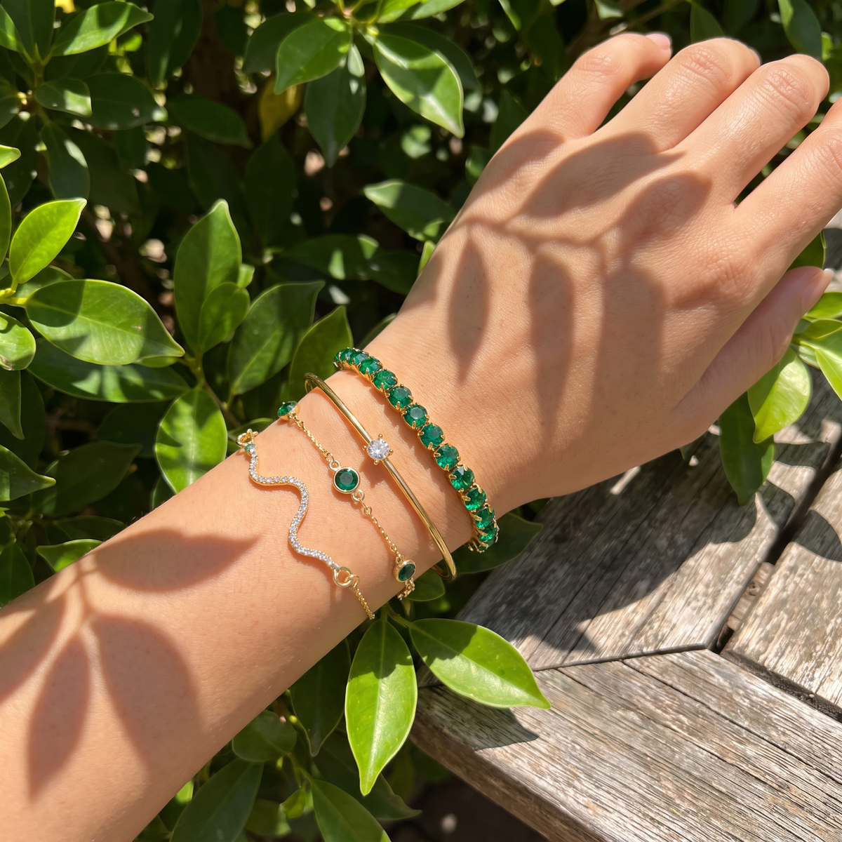 Verena bracelet stack in dappled garden light