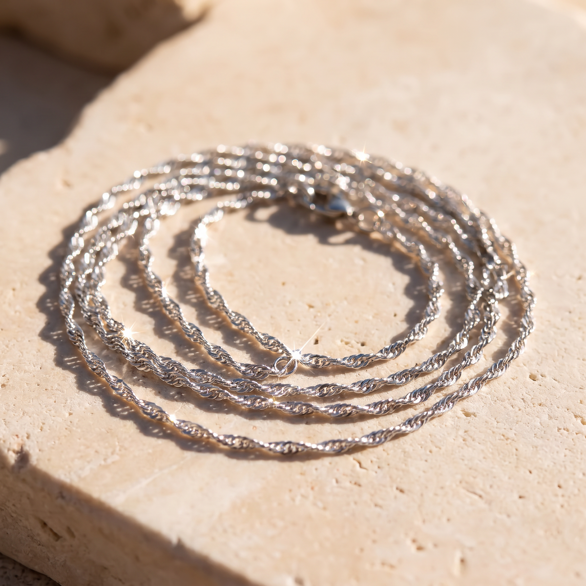 Lumera chain necklace on sunlit stone