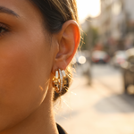 Nova triple crystal hoop worn in golden hour light
