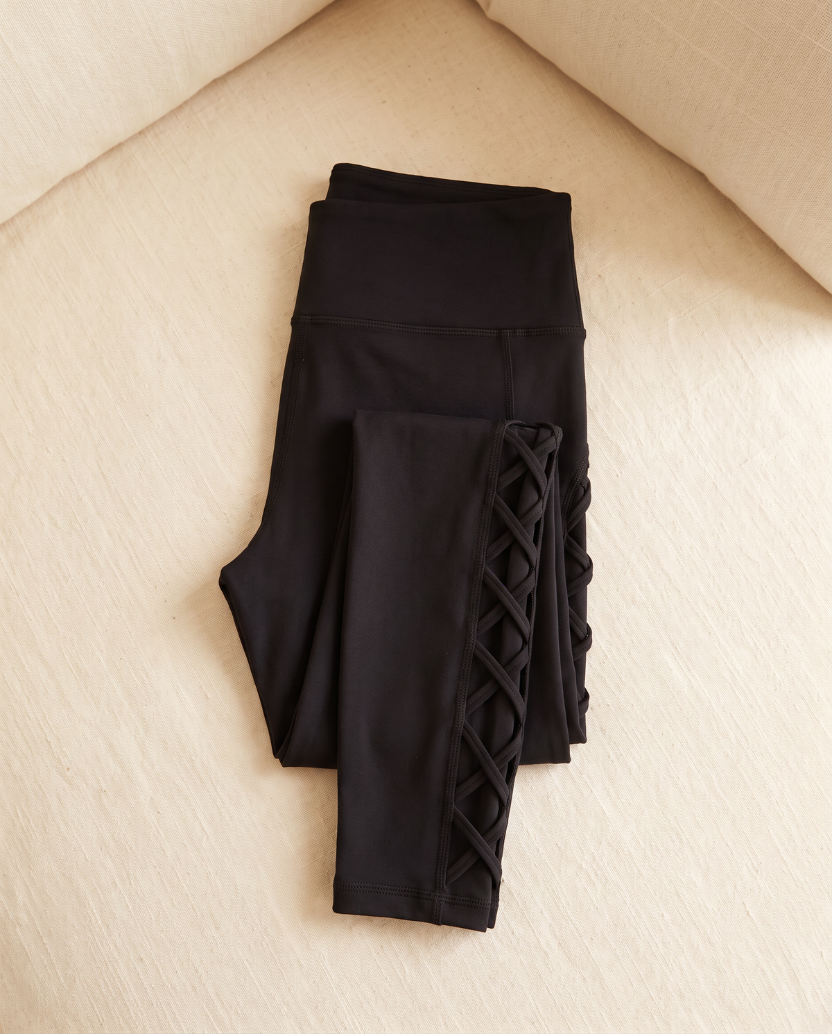 Vesper leggings folded flat on cream linen