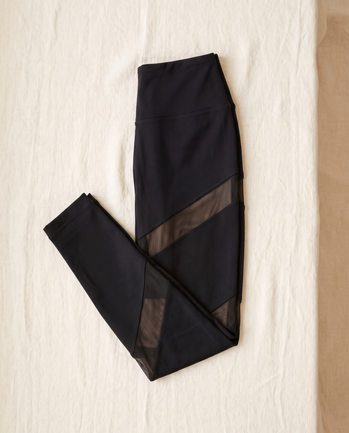 Astrid leggings folded flat on cream linen