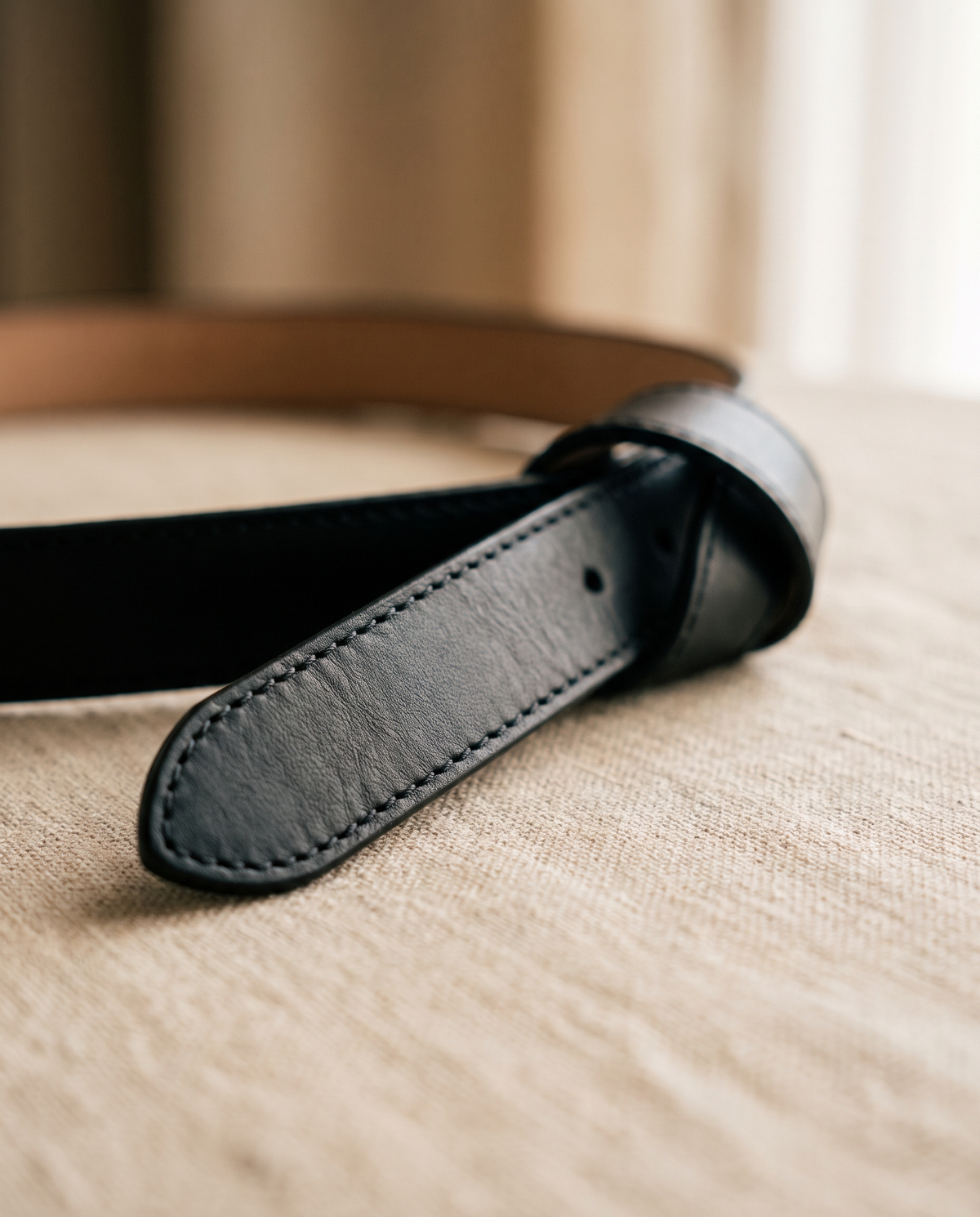 Close up of the belt end and stitched edge