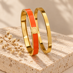 Aurel bangle pair in orange on stone