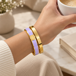 Aurel bangle pair in purple worn on the wrist
