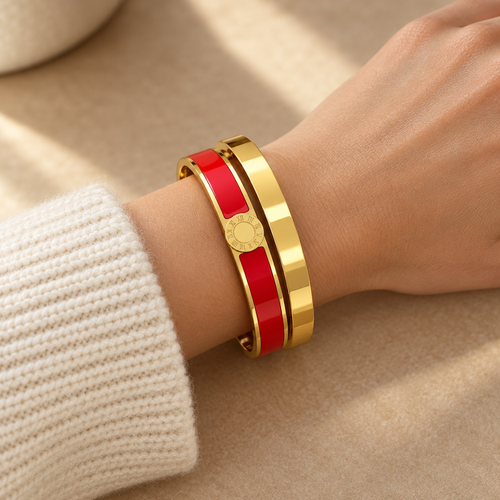 Aurel bangle pair in red worn on the wrist