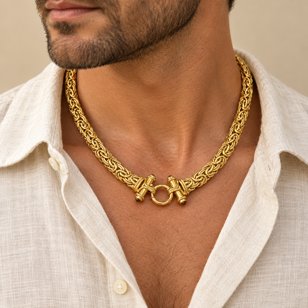 Gold Castor necklace worn over an open collar shirt