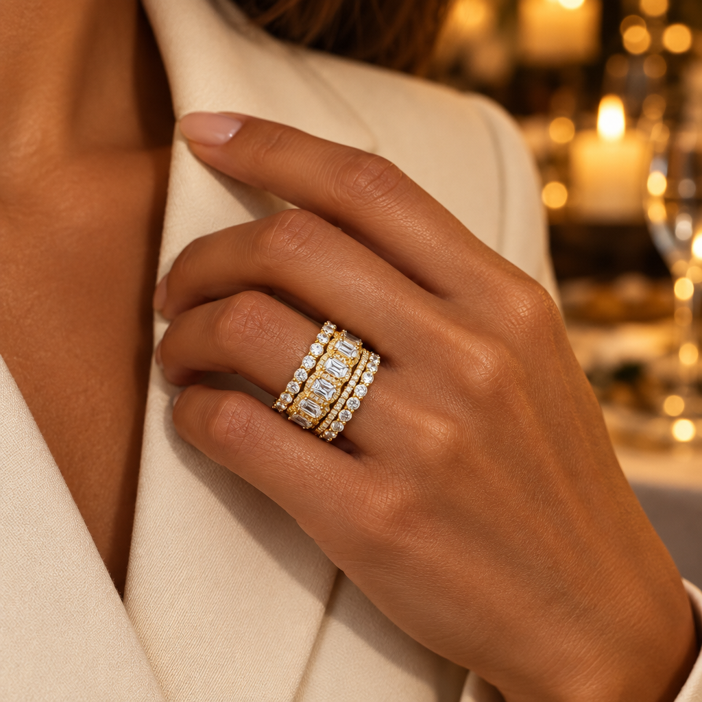 Gold Esme rings stacked on the ring finger