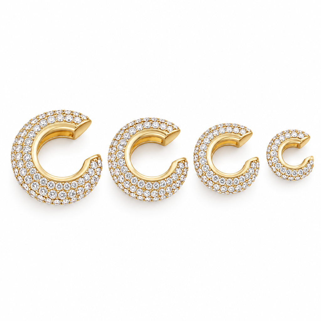 Halo pavé ear cuffs in gold on a white background