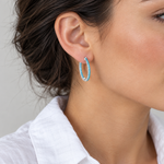 Silver Marina hoop worn on the ear