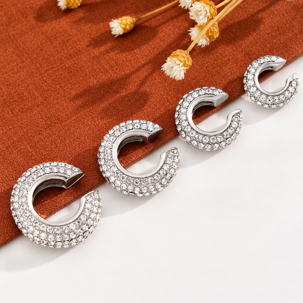 Silver Halo ear cuffs on linen