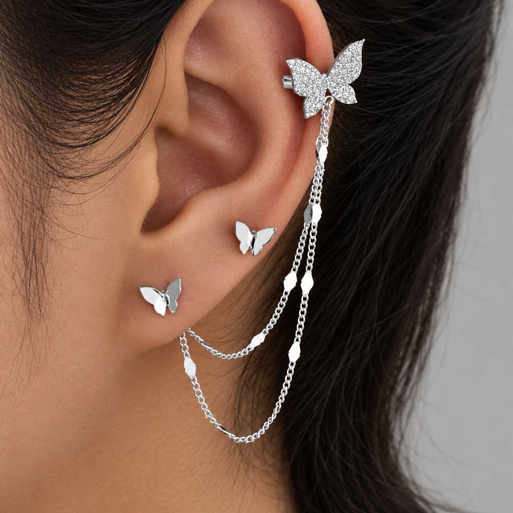 Silver Farfalla chain ear cuff worn on the ear