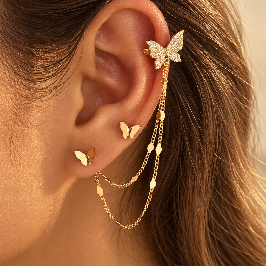 Gold Farfalla chain ear cuff worn on the ear