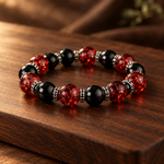 Ember bead bracelet on a walnut board