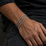 Silver Dorian bracelets stacked on the wrist