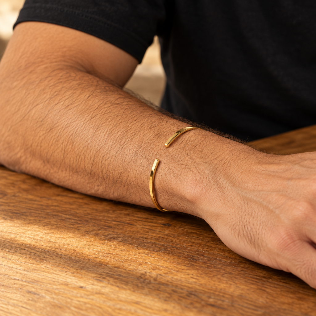 Slim gold tone Vance cuff worn on the wrist