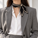 Elodie scarf knotted with a grey blazer