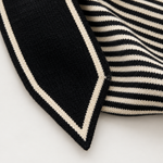 Close up of the cream border and striped knit